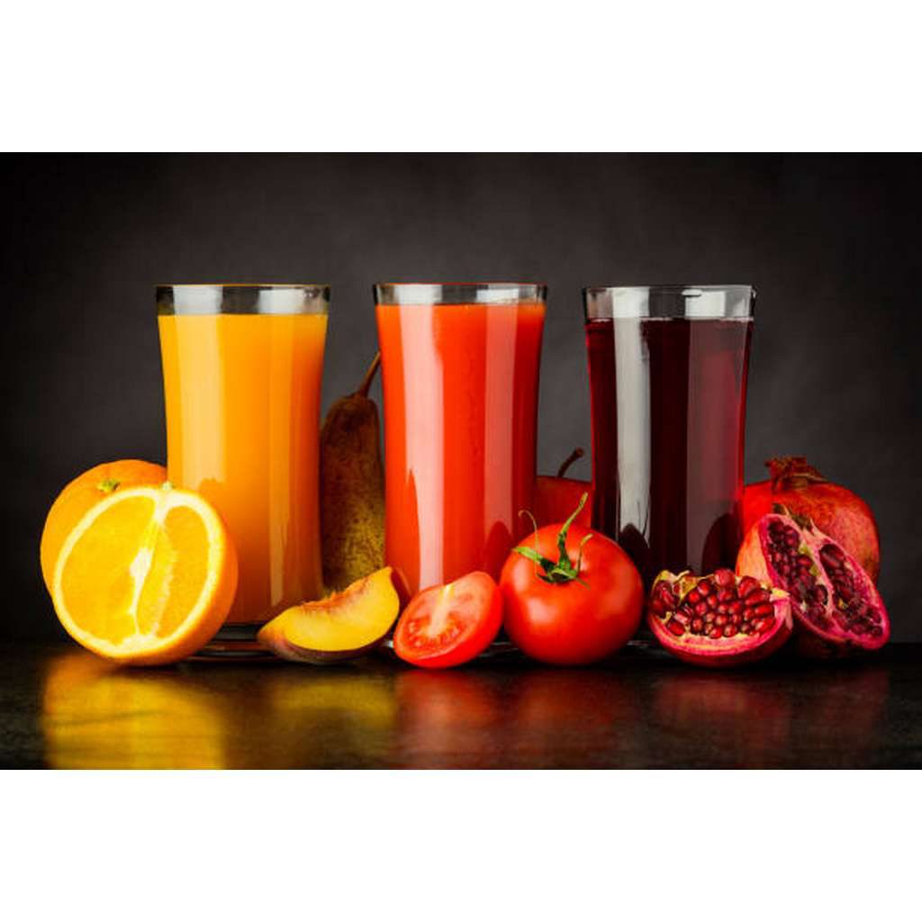 Fresh Pressed Juice Drink from Fruits and Tomato on Dark Background